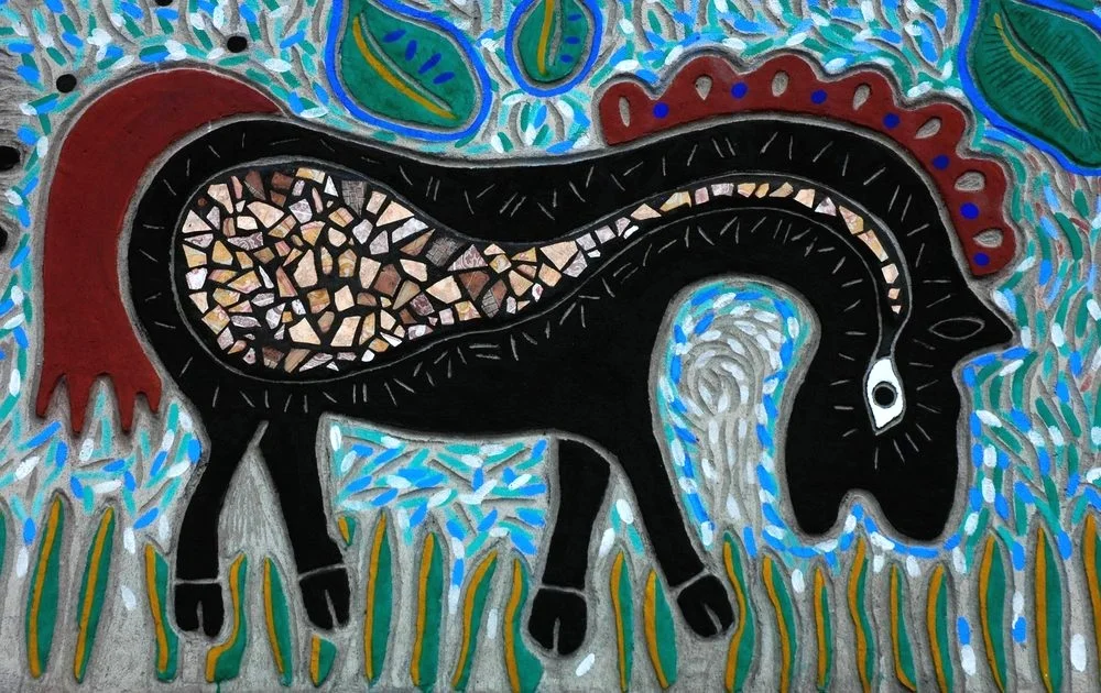 This black horse is eating grass.