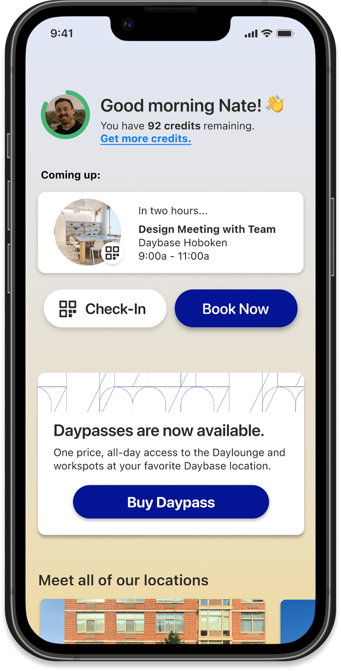 Mobile app screen displaying a greeting to Nate, showing his remaining credits, upcoming meeting details, options for check-in and booking, information about day passes, and images of various locations.