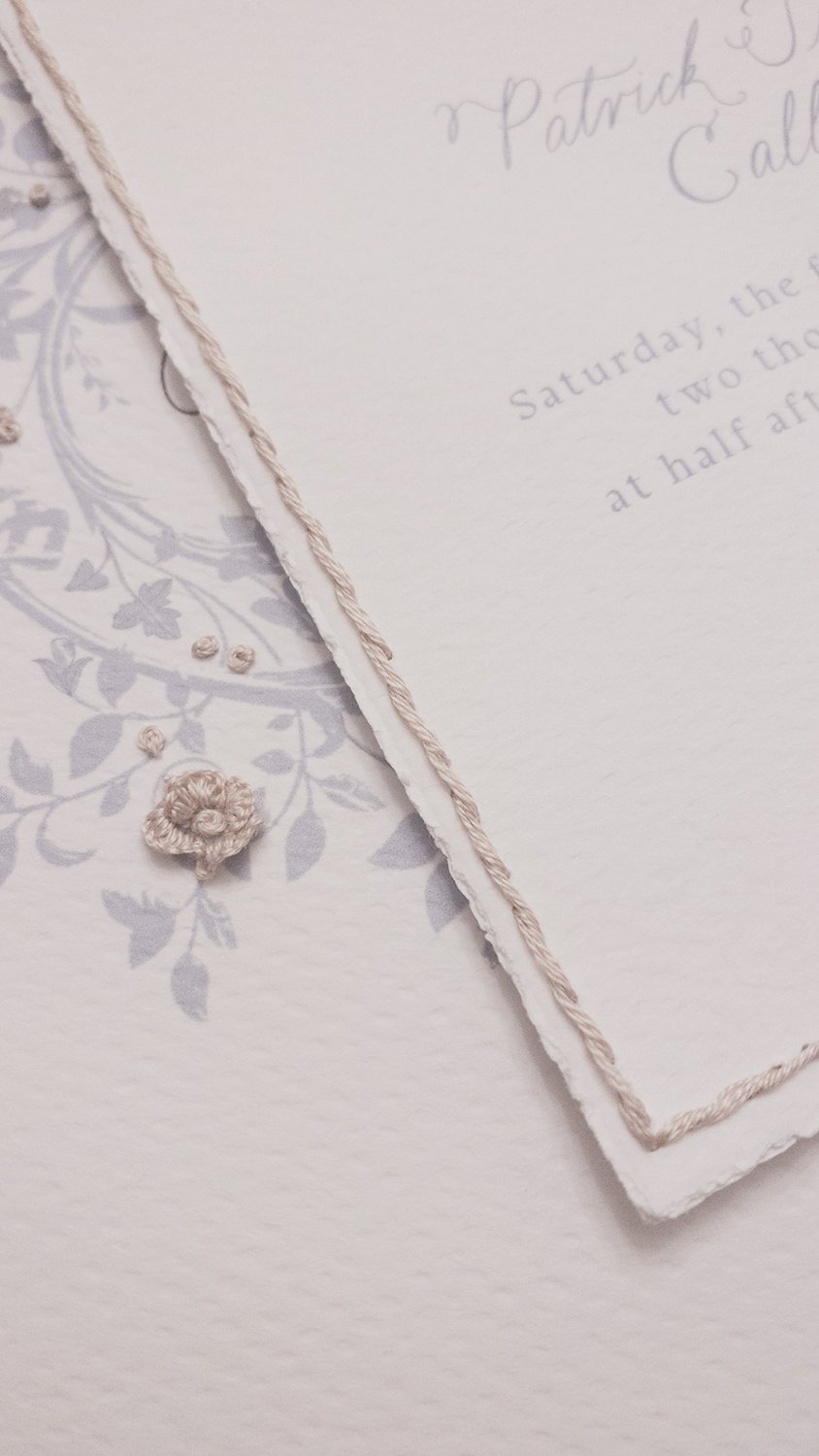 close up details of wedding paper embroidery