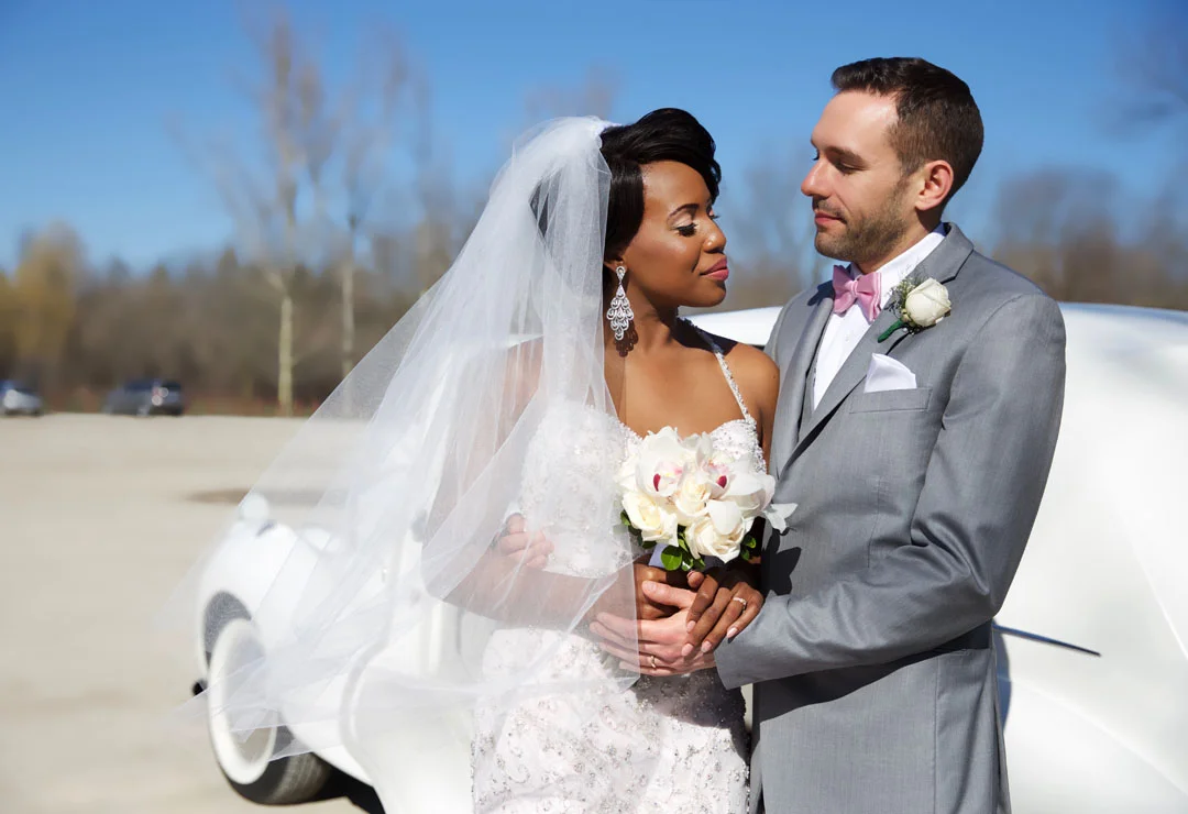 Bride and groom standing outdoors gazing at each other, at El Dorado Park, Brampton