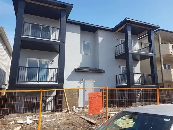 High-quality stucco installation for a new 6 plex home build, ensuring a smooth and professional exterior finish." SE Calgary