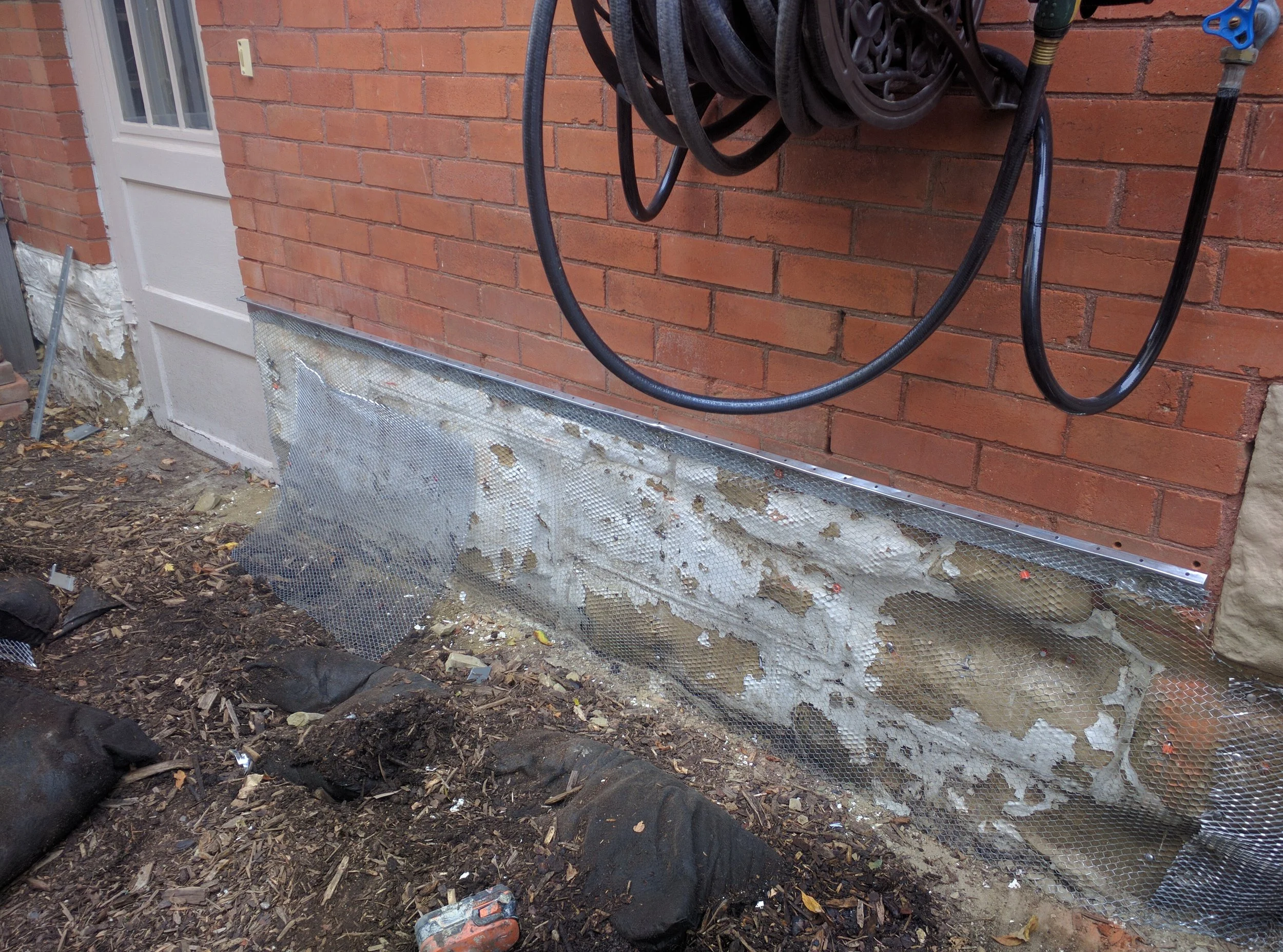 restore parging over lime stone footing with mesh wire and long anchors, lakeview calgary alberta