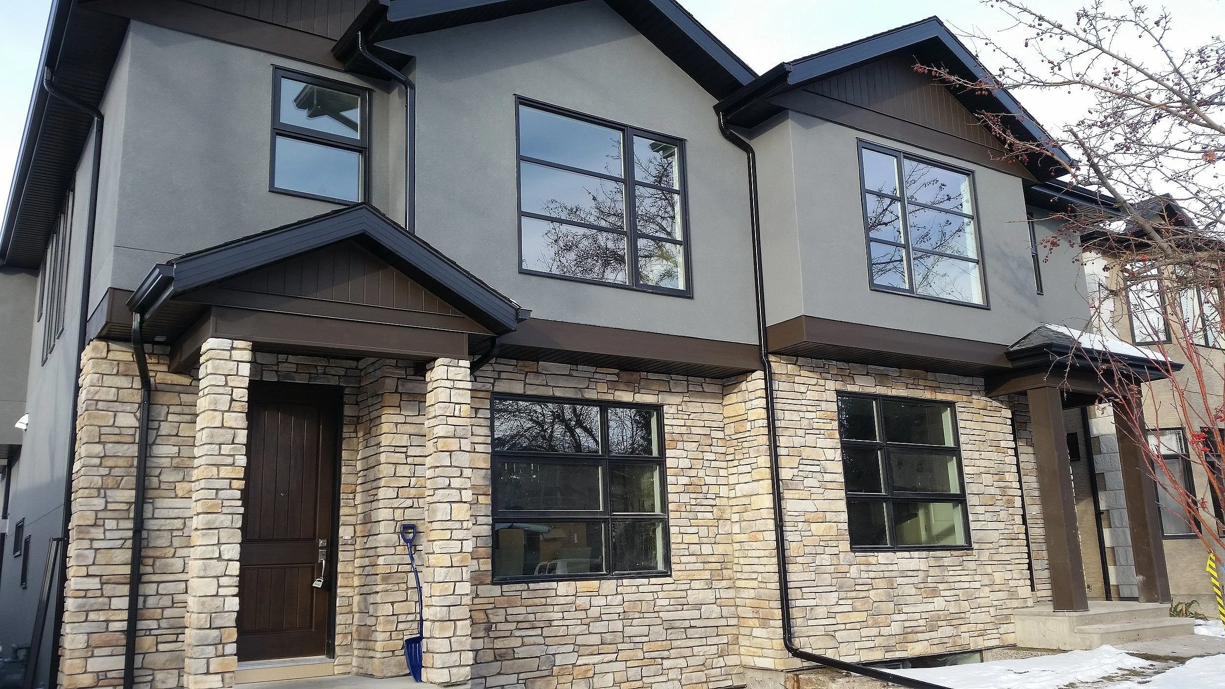 Exterior stone installation for residential home in Calgary