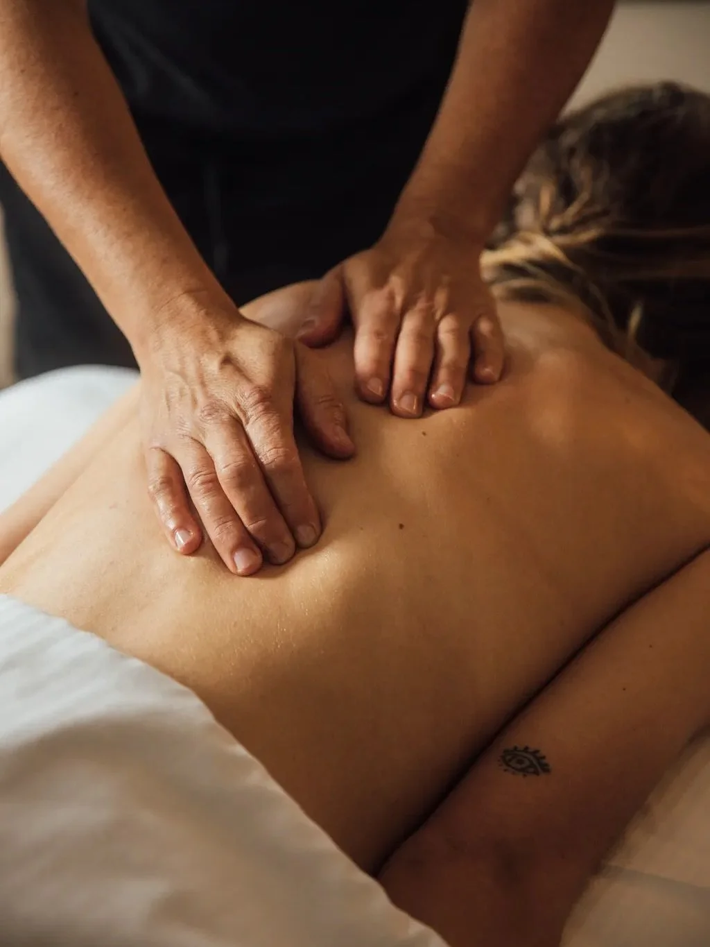 When your body exhales before you do

Our therapists work with presence, intention, and techniques designed to release tension where you actually carry it.
Muscles soften. Breathing deepens.
You leave lighter, clearer, restored.

We are now open all 