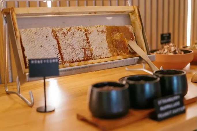 Slow mornings begin here.
Seasonal fruits from the garden, homemade bread, local yoghurt and granola, freshly brewed coffee, honeycomb, smoked salmon, juices and farm-fresh eggs &mdash; enjoyed quietly at the Lodge as the forest and birds surround yo