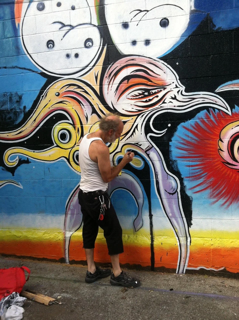 “Odd Delight,” Austin, TX - 2015. Acrylic / oil on CMU, 12 ft x 60 ft.