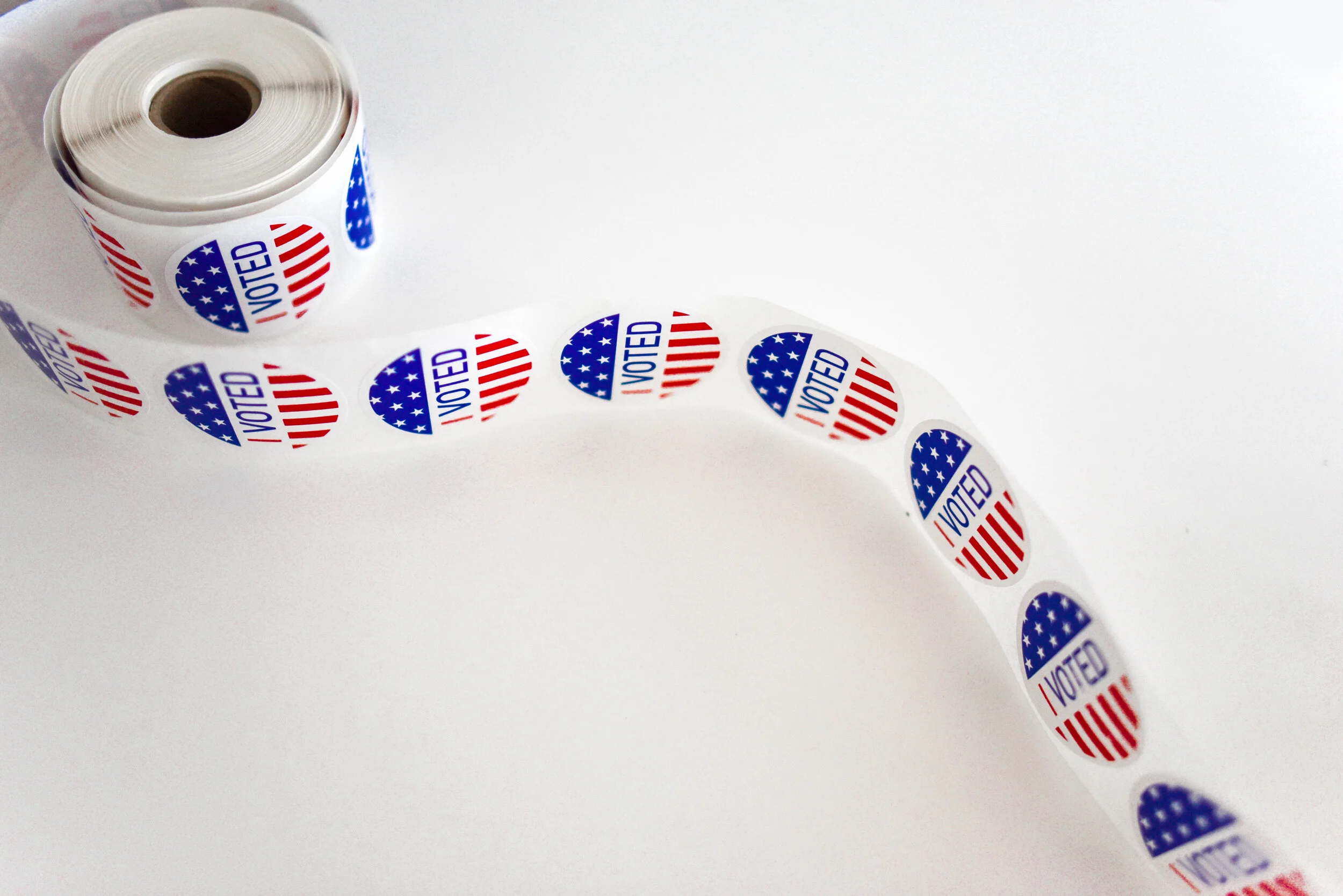 Canva - I Voted Sticker Spool on White Surface.jpg