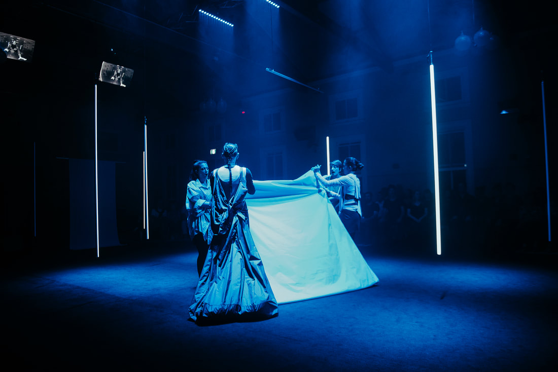 The formal flag folding sequence in Act II. Image by Rachel Barrett.
