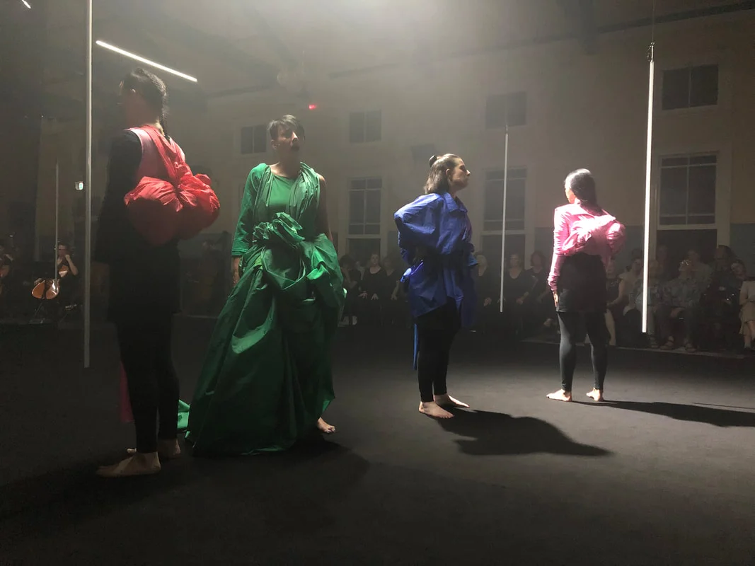 The four soloists wearing the 'flags' in their final state.