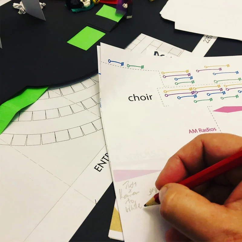 Noting and coordinating the staging/tracking on the score. You can see my scale model of the stage in the background.