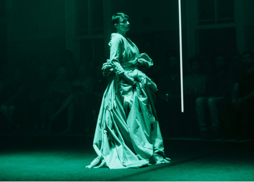 The green opera gown on stage, as worn by Judith Dodsworth. The sleeve the soloist wears is stitched into the larger piece. One of the light bars is also clearly visible here.