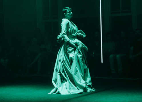  The green opera gown on stage, as worn by Judith Dodsworth. The sleeve  the soloist wears is stitched into the larger piece. One of the light  bars is also clearly visible here.   