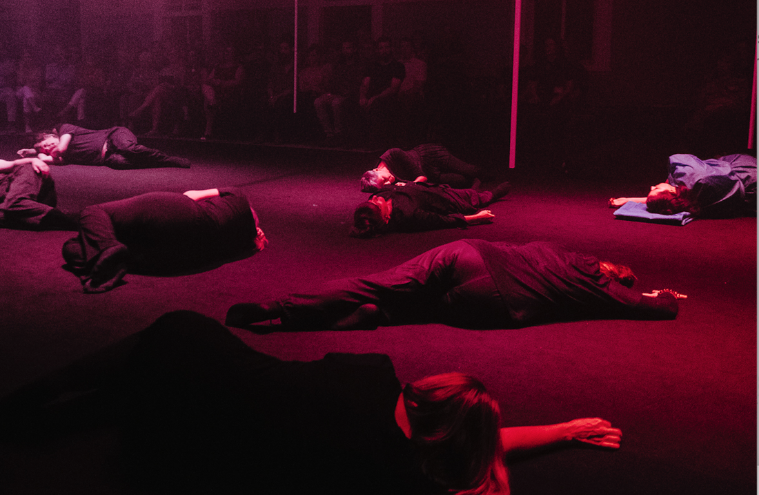  Some of the bodies on the floor in the feedback interlude between Act II and Act III. Photo by Rachel Barrett. 