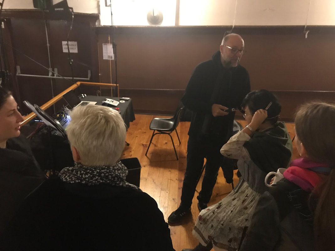 Vocalists trying their head set mics with our wonderful tech, Guy Smith.