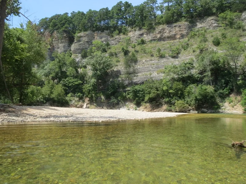   Ozark streams  typically occupy narrow, steep-sided valleys and often amount to a series of short pools connected by  well-defined riffles . 