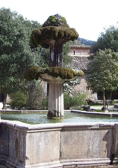The fountain in the court of Monastery Lluc, where the lime-rich water has caused a mountain of sinter to grow on the top.