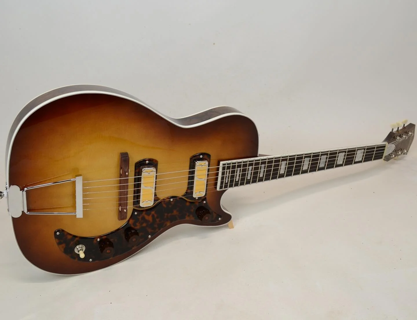 A walnut burl custom Jayne 
-
Walnut burl back and sides, sunbursted sitka spruce top, walnut neck, walnut burl front and back peghead overlay.  High gloss Nitrocellulose lacquer, Curtis Novak gold foil pickups, availible for purchase - $6800 , dm or