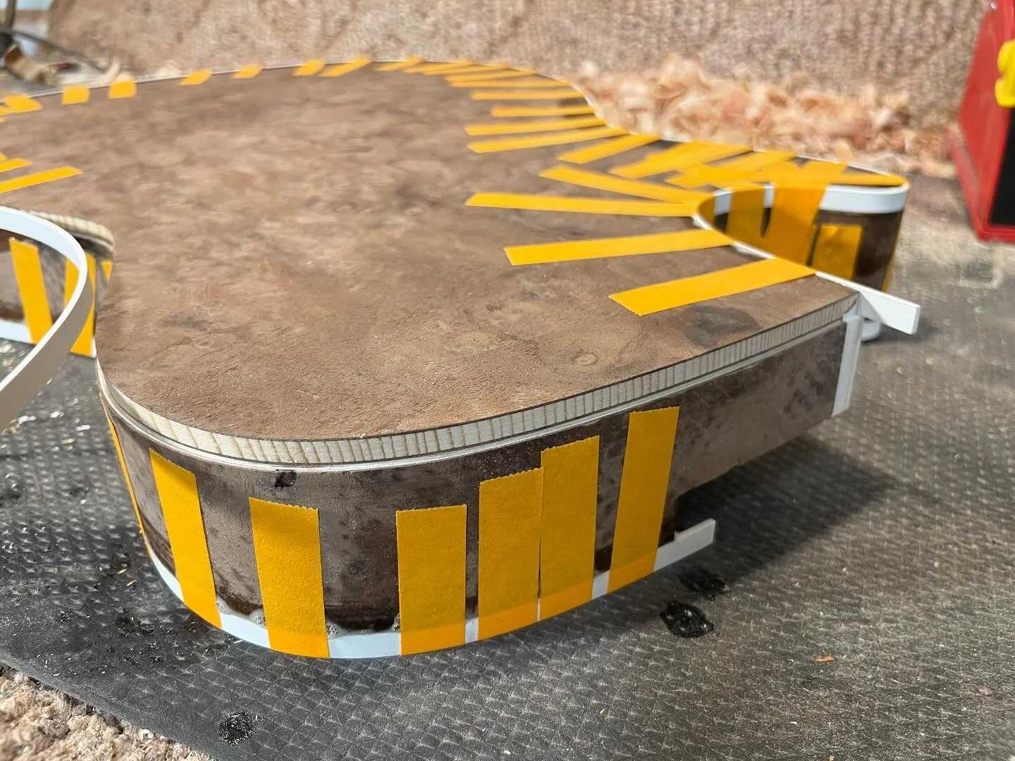 Sitka spruce back with walnut veneers
-
The Jayne getting binding installed.  The sides are 5 layers of maple/birch with walnut on the outer layers.
-
#crispy #binding #chanel #channel #rabbet #rabbit #groovy #quartersawn #quartered #veneer #trim #tr