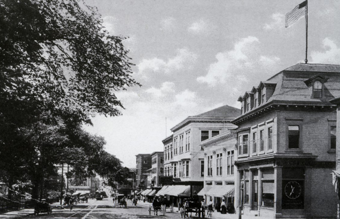  Another view looking west down Washington Square (c. early 1900). The buildings have changed and the street car is now seen in the picture. 