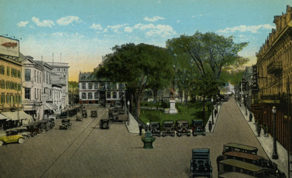 Washington Square looking east, early 1920’s. The 4-story building on left will become the Savings Bank building in a few short years.