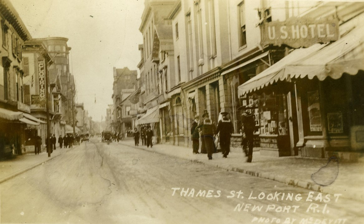  Thames Street looking north from Pelham Street. Although a little earlier (c. 190x), the city retained this view until the 1970’s. Note the clock face on the right-hand side of the photo, 6 buildings up. 