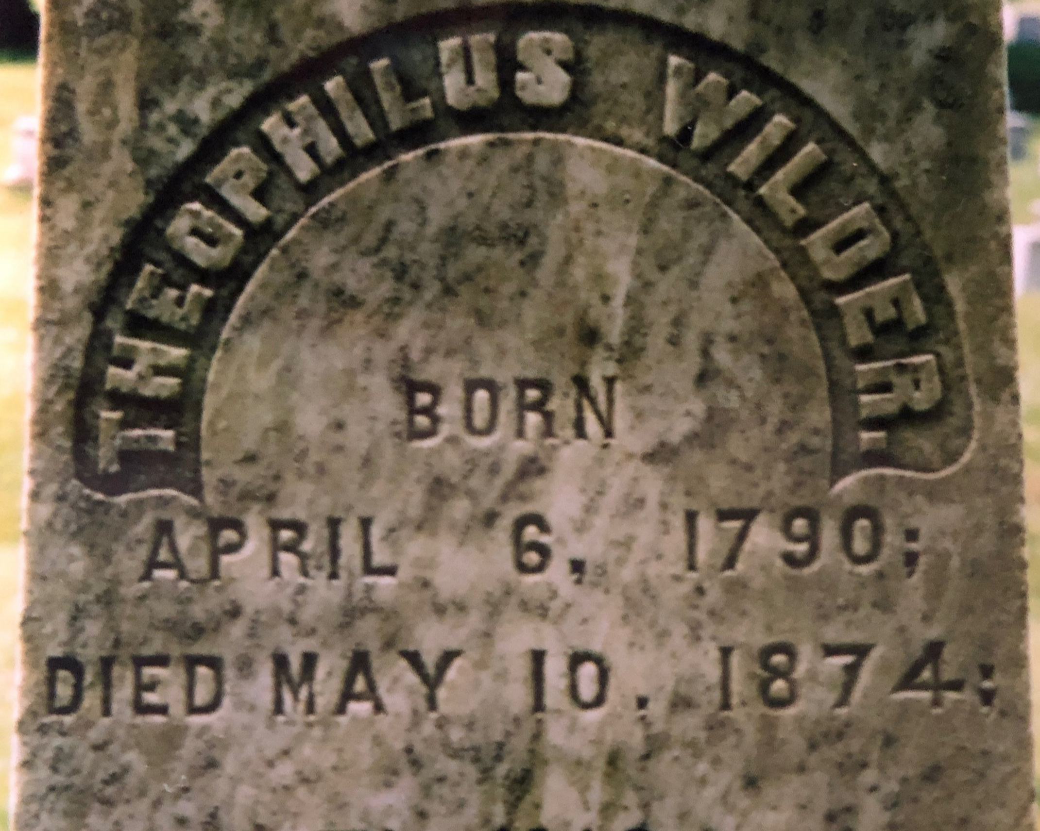 A closeup of Theophilus North, III’s gravestone nearby.