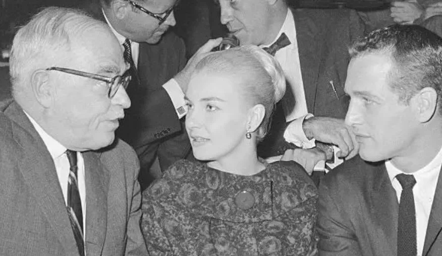 Pictured here is Wilder with Paul Newman and Joanne Woodward in 1959. On this day, 43 years after this photo was taken, Our Town opened on Broadway, with Newman playing the Stage Manager. This @wcplayhouse production was directed by James Naughton. 
