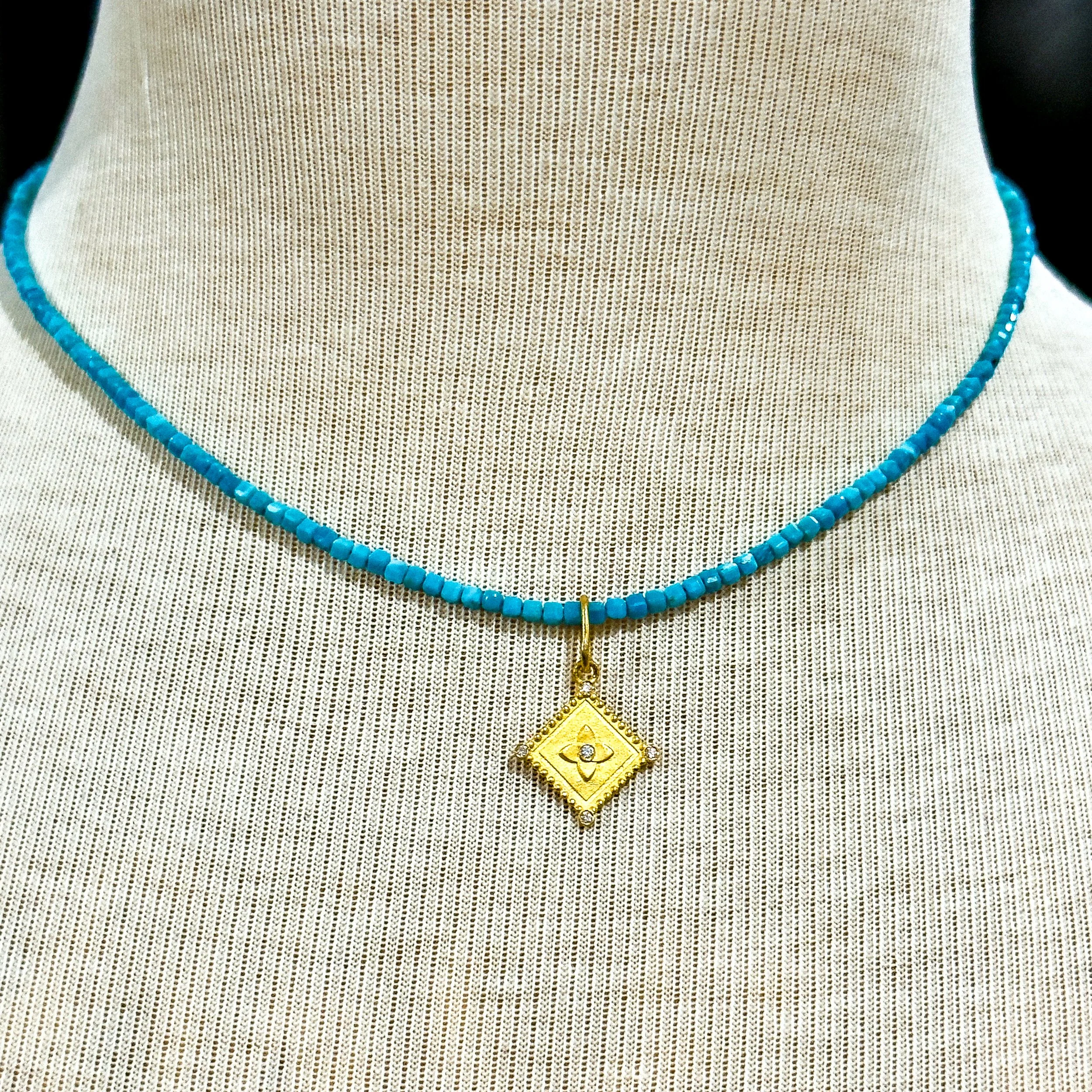 24k aq pend on neck.jpg