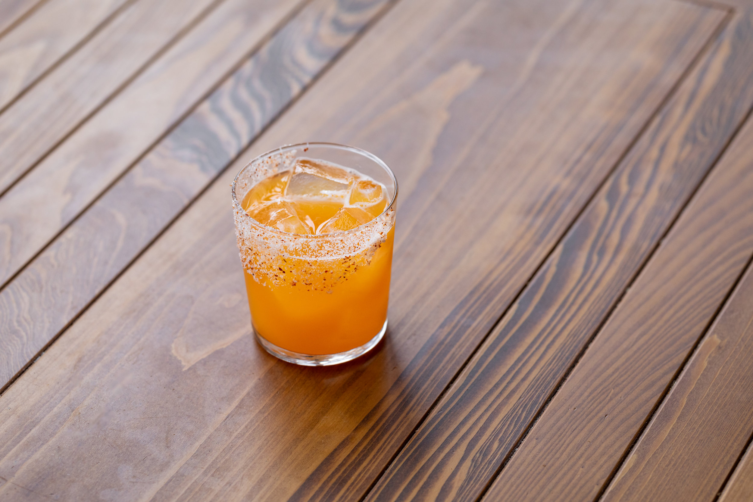 photo of an orange colored cocktail