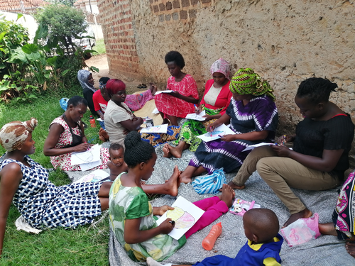 A literacy and empowering session for young mothers in the slums of Kampala.