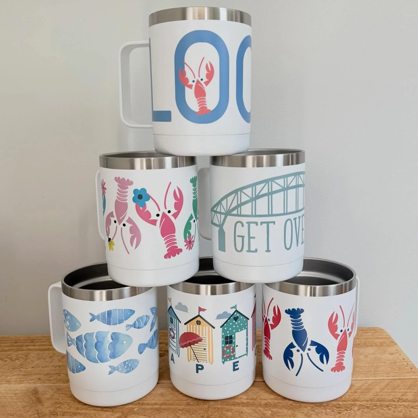 Introducing the New Summer Mug Collection!! A whole new set of designs featuring 2 new &ldquo;LOCAL&rdquo;, 2 awesome lobsters, beach shacks, fantastic fish, and of course my best seller &ldquo;Get Over It&rdquo;! Which one is your favorite? DM me fo