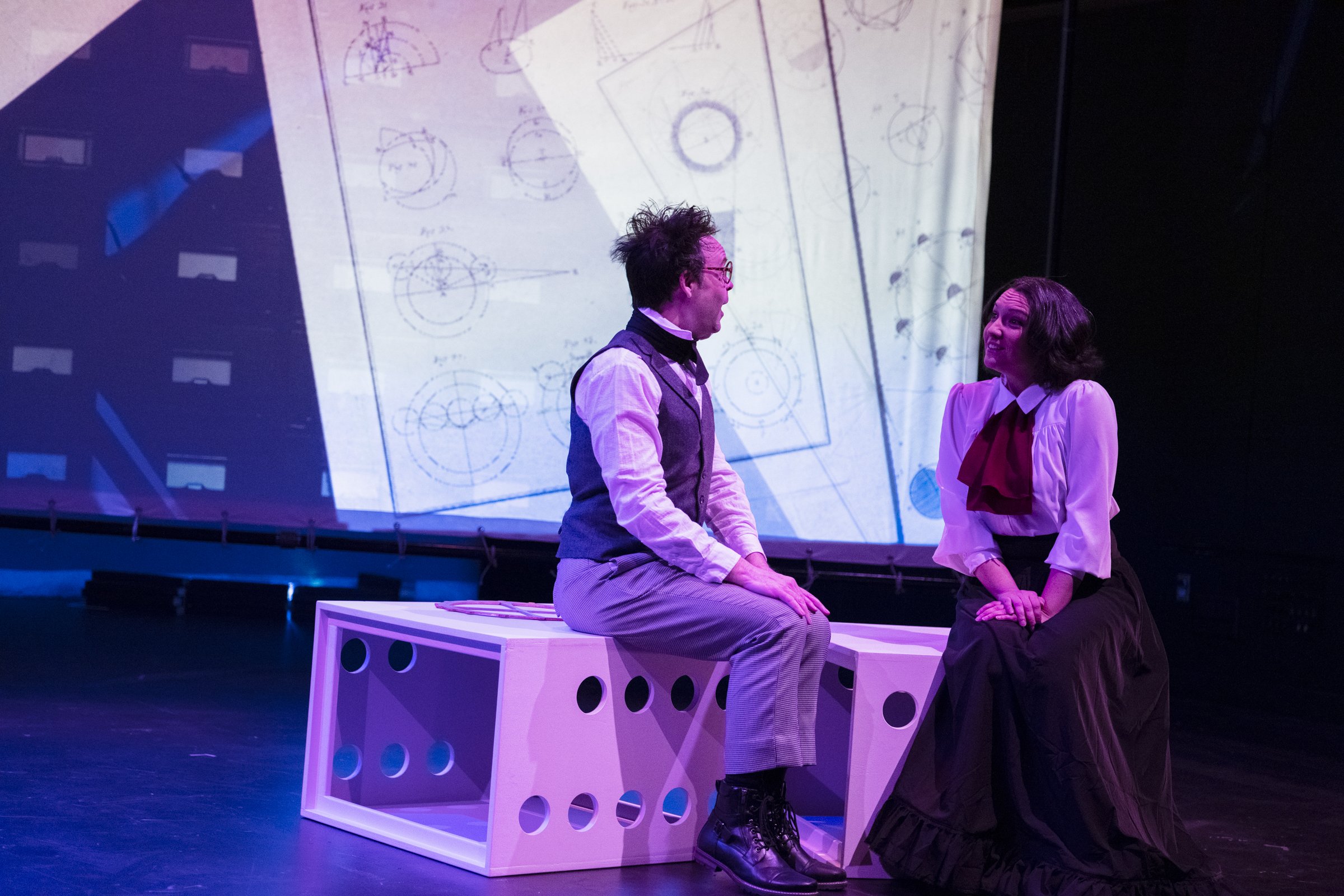 2. Aaron Engebreth as Charles Babbage and Aliana de la Guardia as Ada Lovelace talking about their inventions.jpg