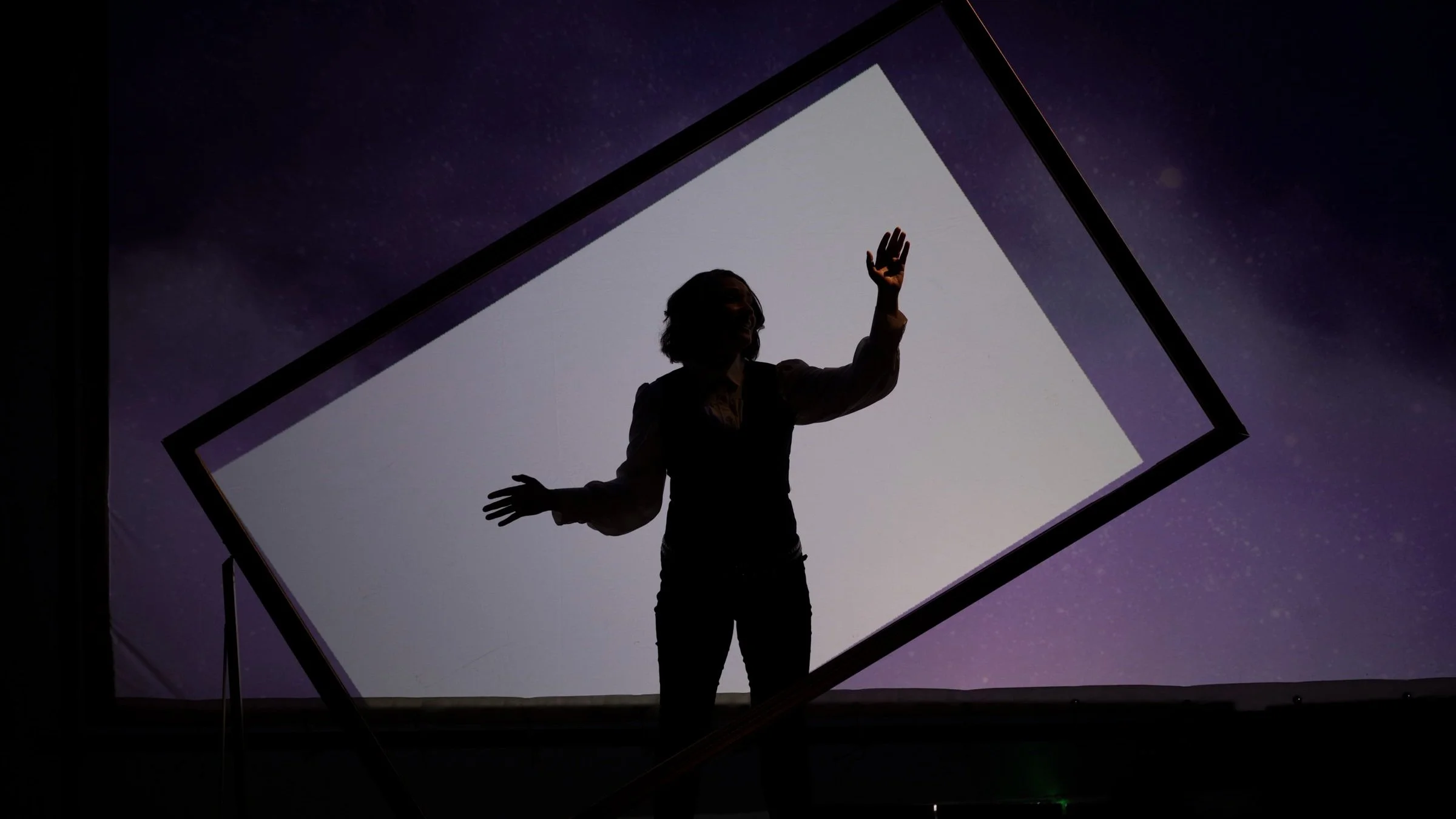 Silhouette of Aliana de la Guardia as Ada Lovelace in the final scene of the opera.jpg