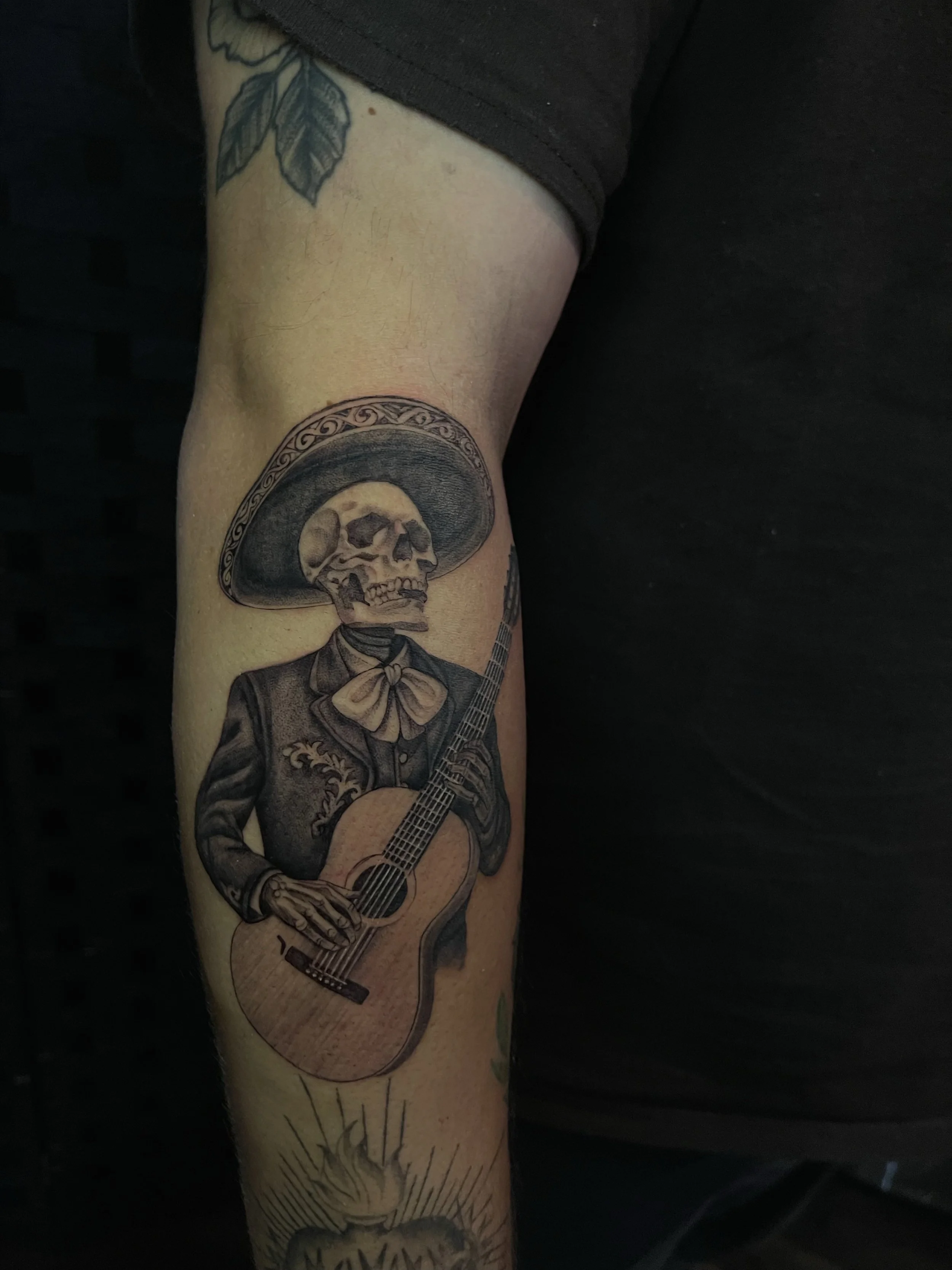  fineline realism of a Mariachi Skelton done by our artist Nancy 