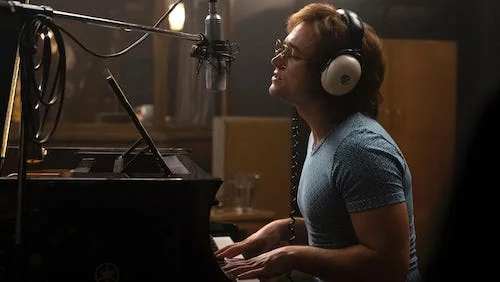 A younger, shyer Elton John getting studio time.