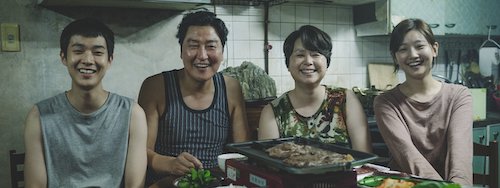 A portrait of a smiling, yet struggling, family.
