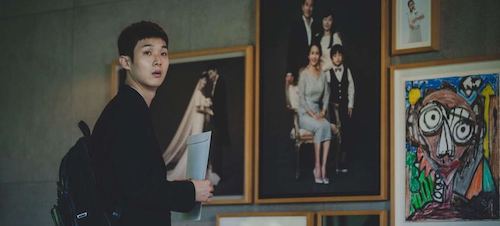 Son Ki-woo observing the ideal displays of a functioning, successful, happy family.