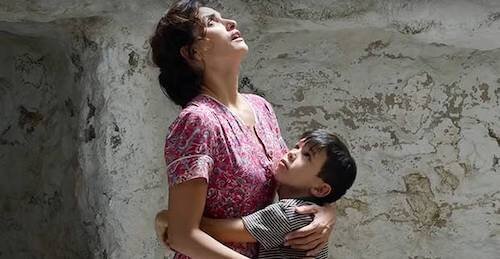 A young Salvador and his mother, both embracing their new living conditions.