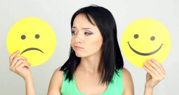 woman-with-happy-and-sad-emoticons-600x320.jpg