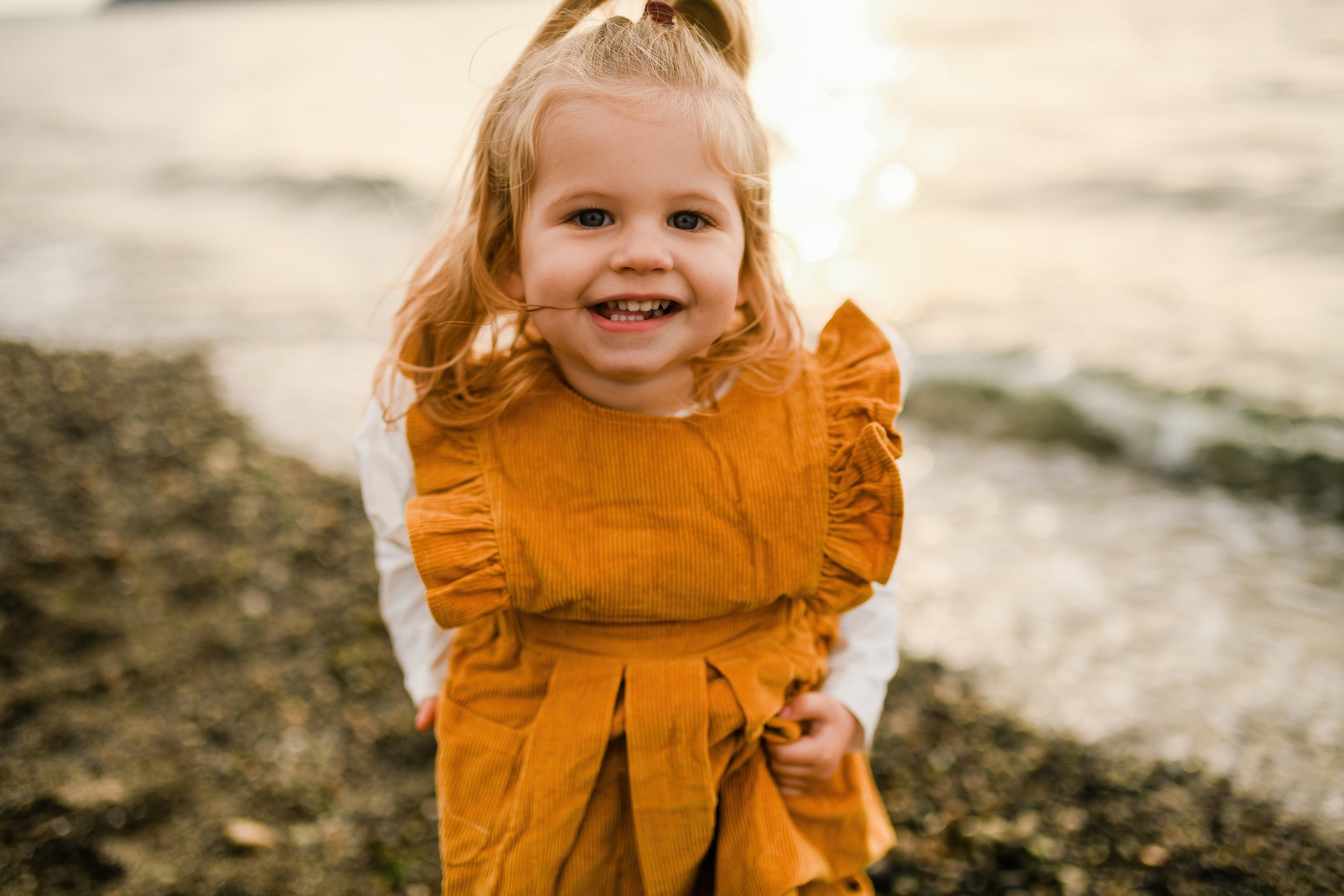 dancing-toddler-in-sunshine-mukilteo-beach-photographer.jpg