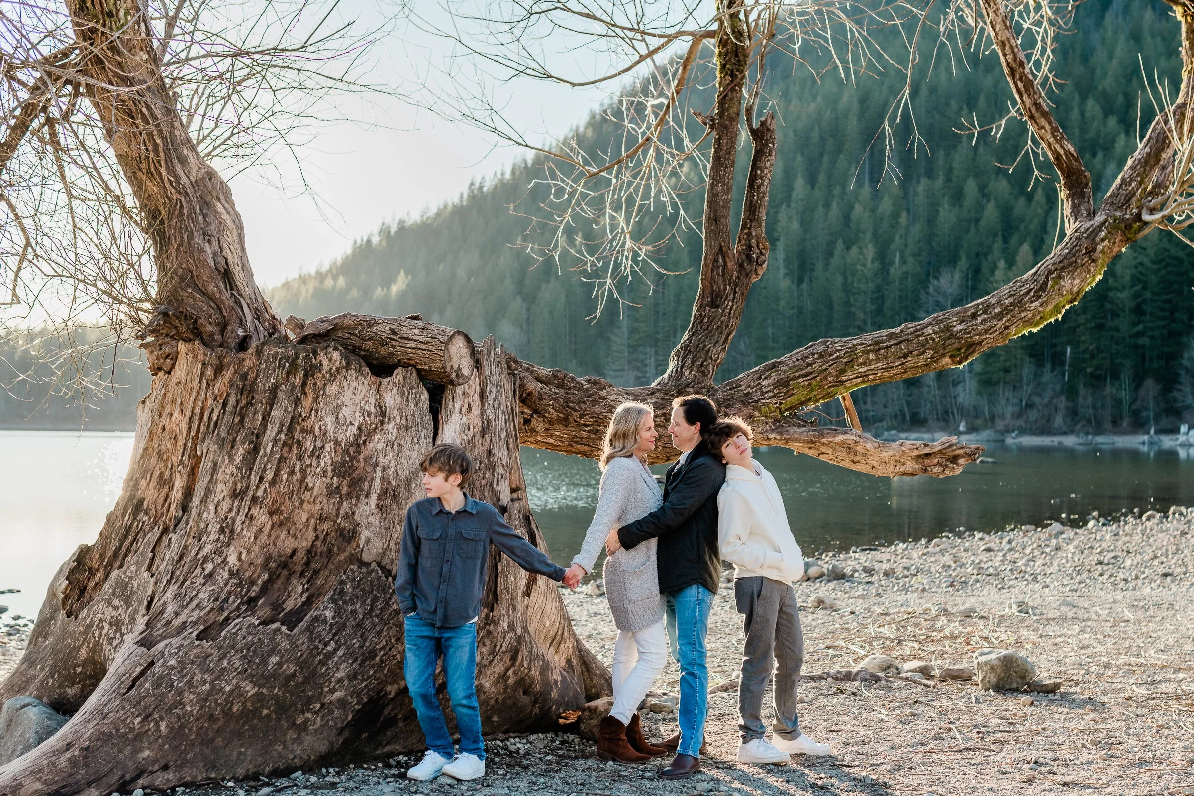 Sunny family portrait in the gorgeous landscape of Rattlesnake Lake by Katie Niemer Photography