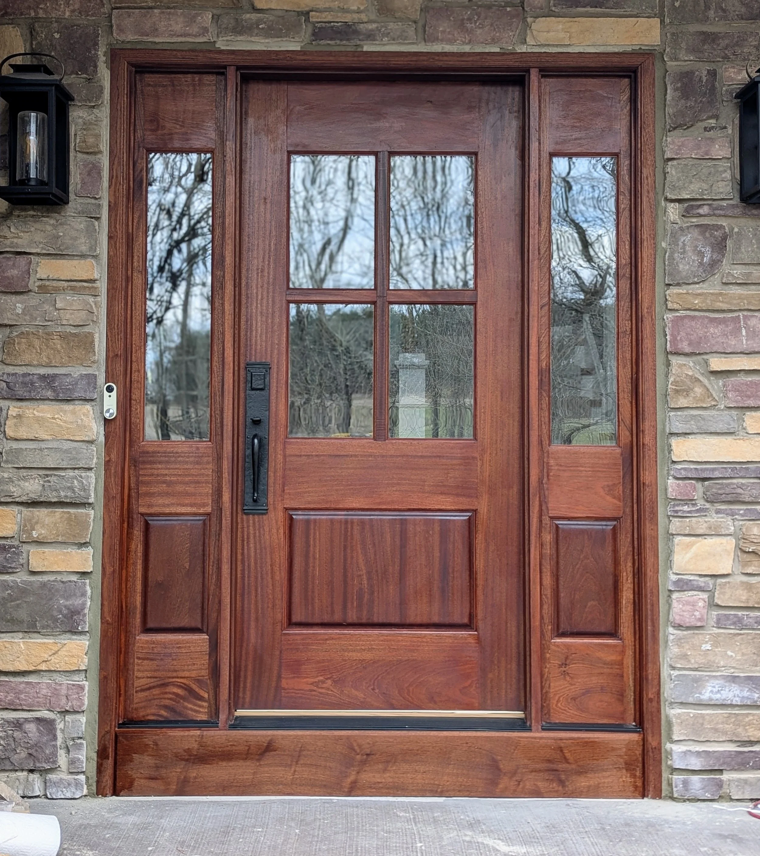 Mahogany exterior door with side panels