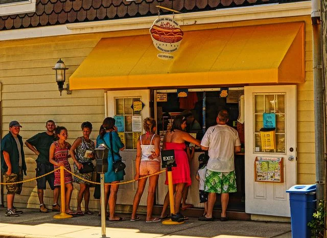 Hungry beach-goers wait in line at Hot Dog Tommy’s in Cape May, NJ