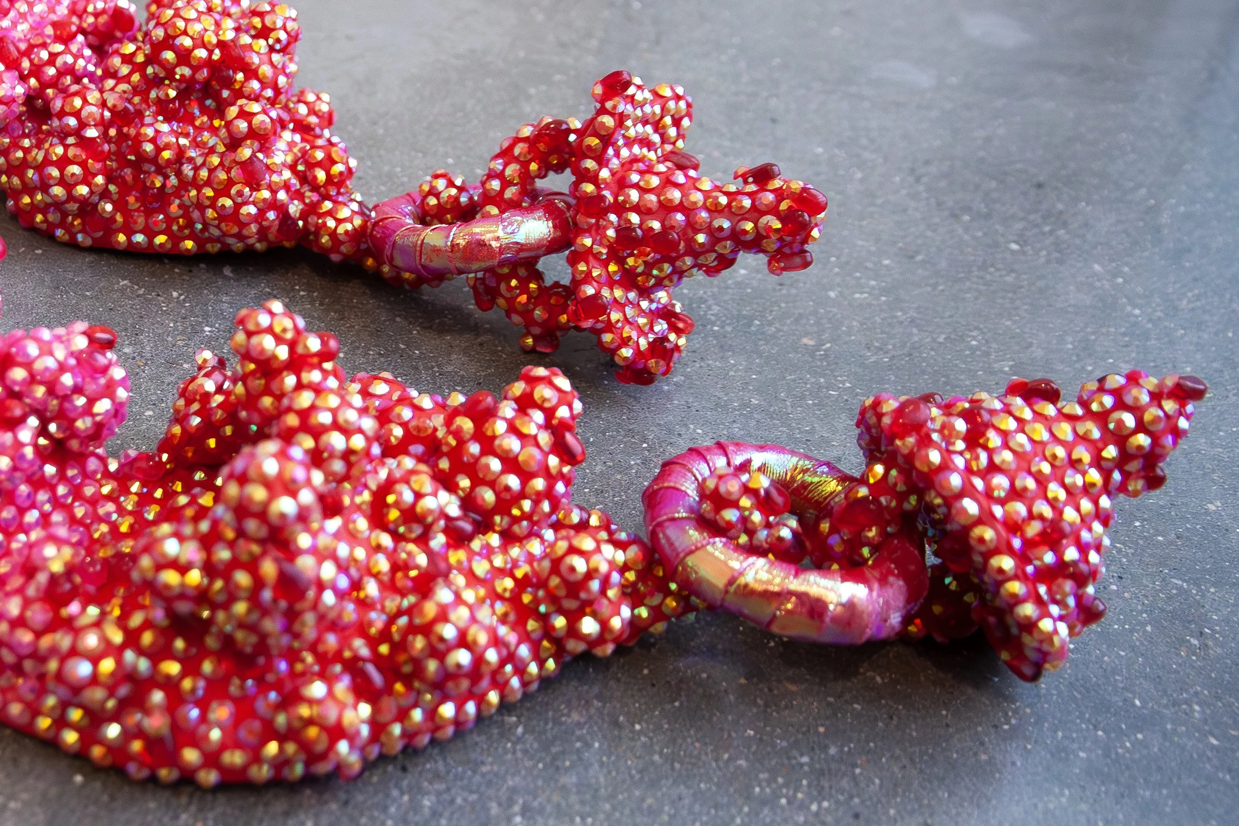   Six Weeks To Stand  (detail) ,  2026. Ceramic, acrylic, rhinestones, glass beads, holographic plastic. 10” x 21” x 4.5”     