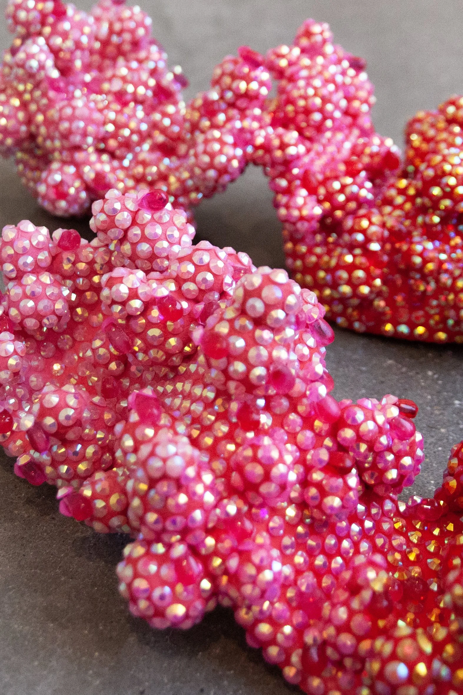   Six Weeks To Stand  (detail) ,  2026. Ceramic, acrylic, rhinestones, glass beads, holographic plastic. 10” x 21” x 4.5”   