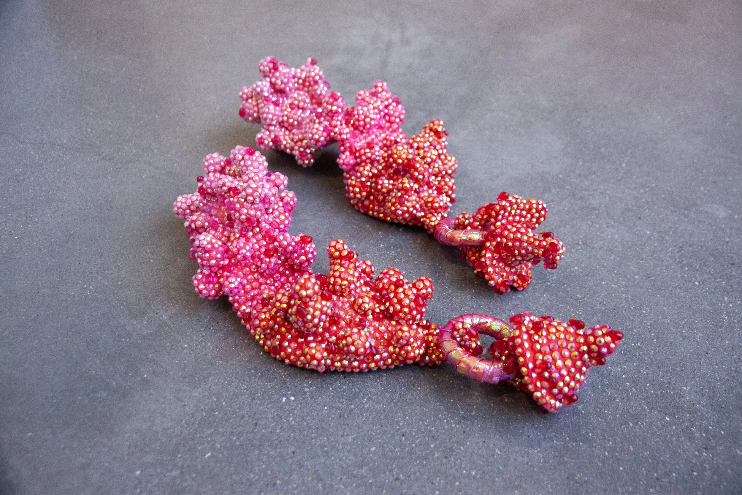   Six Weeks To Stand,  2026. Ceramic, acrylic, rhinestones, glass beads, holographic plastic. 10” x 21” x 4.5”   