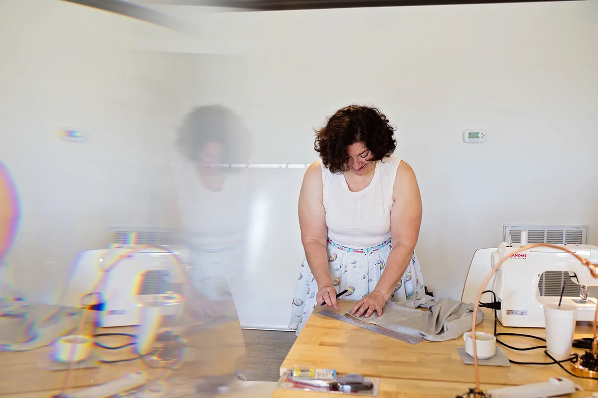  Amanda Lee measures fabric at The Slow Fashion Workshop. 