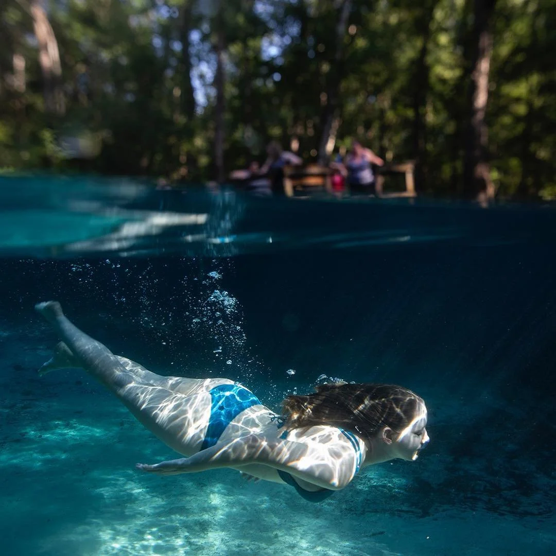  Grace Schweizer dives at Gilchrist Blue Springs. 