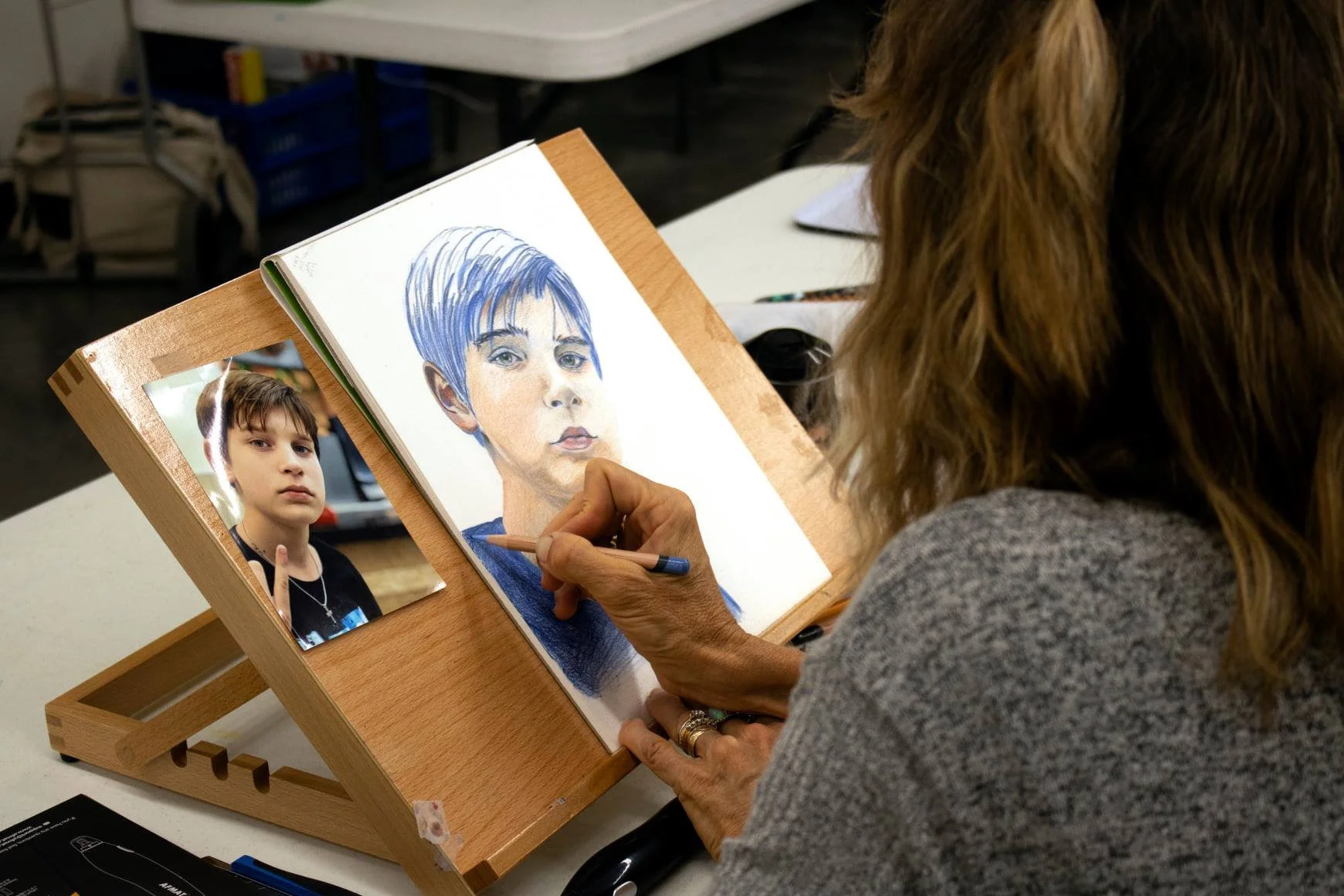  A student at Dunedin Fine Art Center sketches a portrait. 