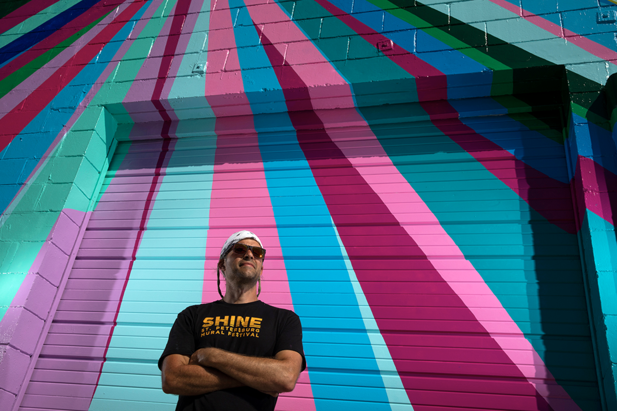  Gibbs Rounsavall poses for a portrait at his mural. Rounsavall and his family live in Louisville, Ky., where he taught high school art for 12 years. He made the career leap to being a full-time artist in May of 2018.   